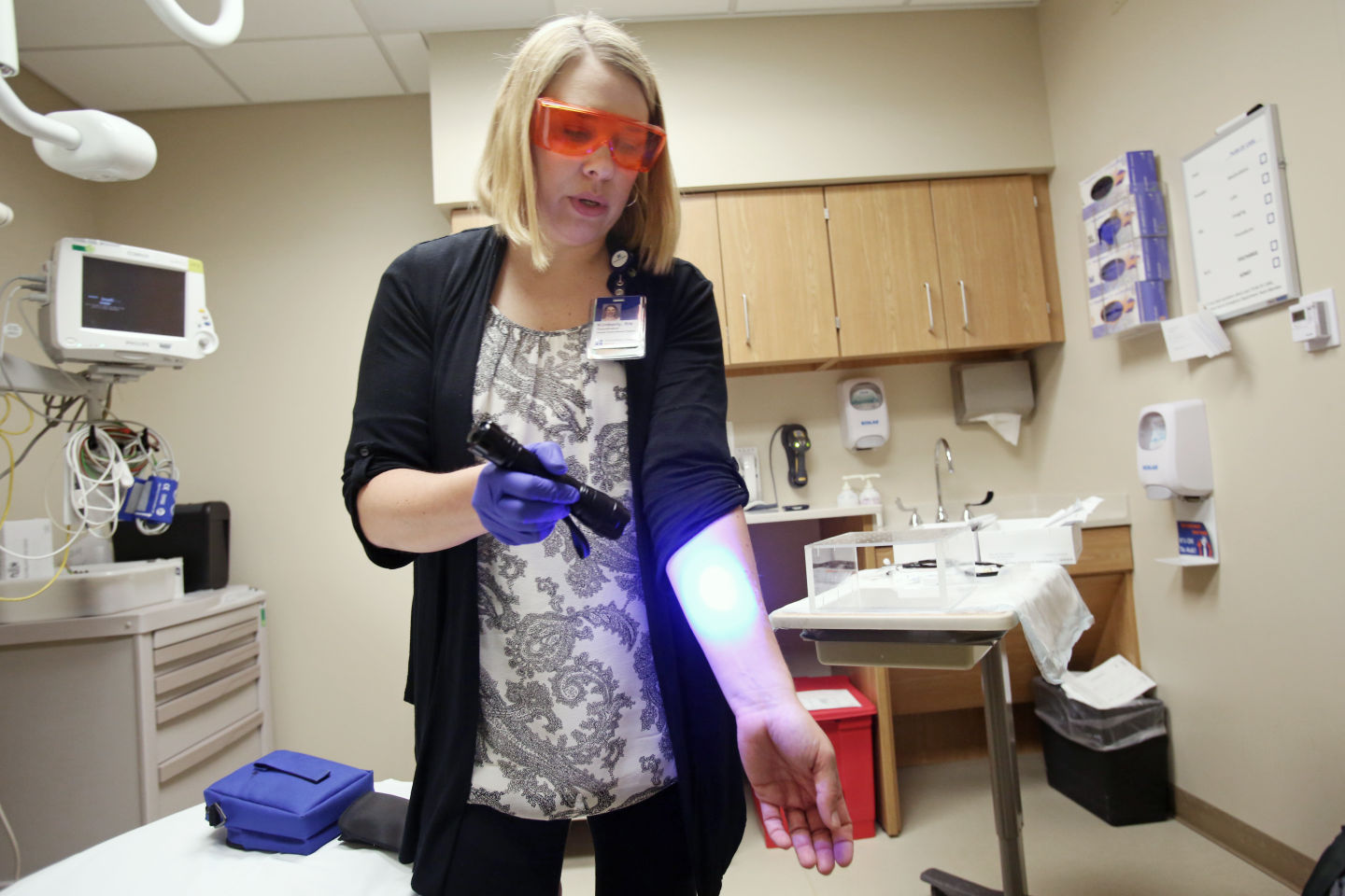 Curran demonstrating fluorescent light